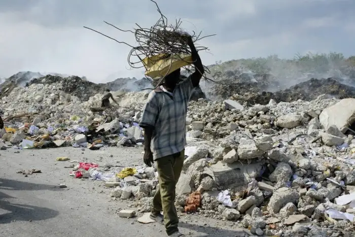 Charity Picture Man Carrying Rubble
